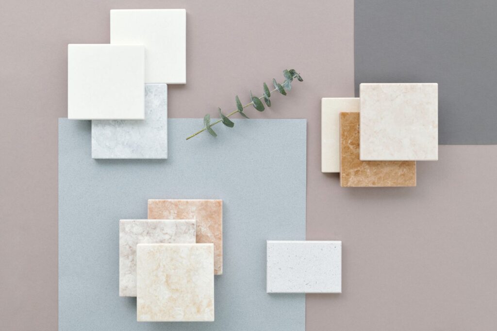Non-Toxic, Plastic-Free Flooring Options for Florida Homes 9 plastic-free flooring samples including cork, solid hardwood, and tile displayed in a bright Florida kitchen