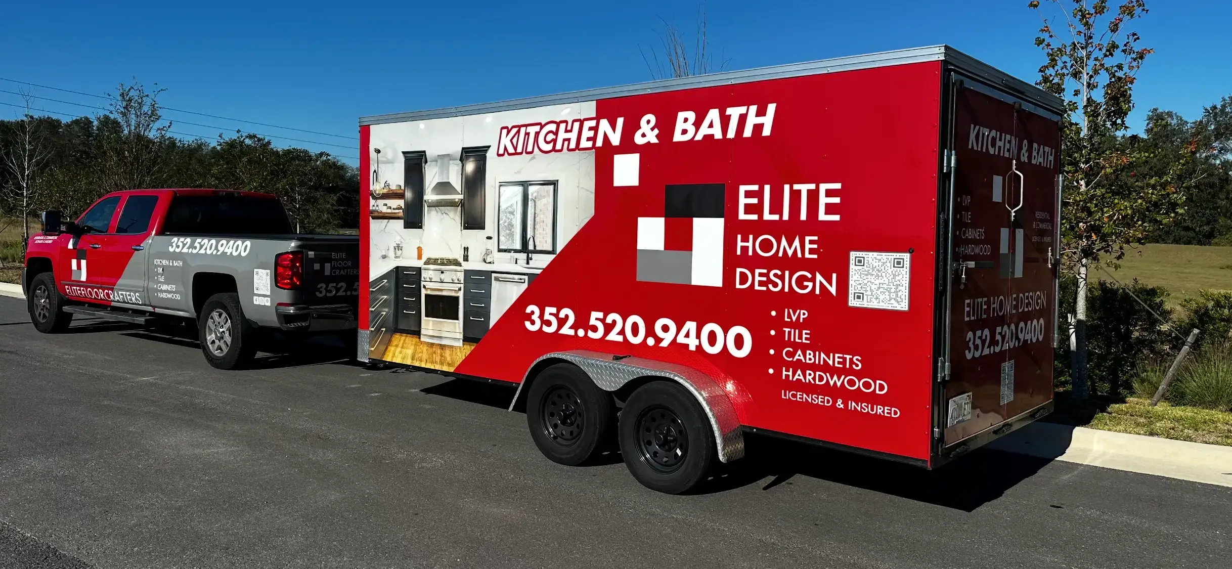 A red and gray branded Elite Floor Crafters - Home Design work truck and enclosed utility trailer parked outdoors in Ocala, FL advertising kitchen and bathroom remodeling and flooring services.
