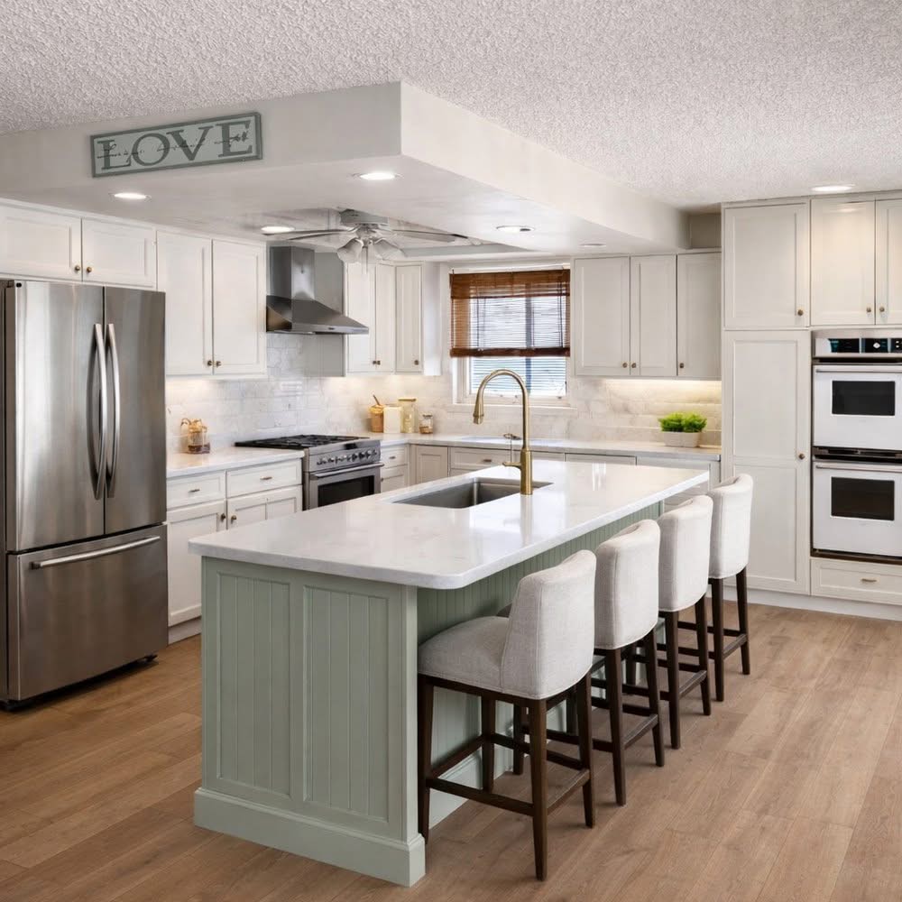 Services 3 Modern remodeled kitchen in Gainesville, FL with light wood-look vinyl flooring, white cabinetry, a sage green island with gooseneck faucet, and stainless steel appliances.